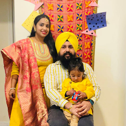 A family raising a trilingual child (teaching him English, Hindi, and Punjabi) in the US