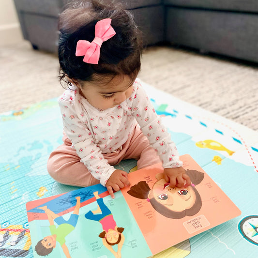 bilingual baby playing with bengali blocks