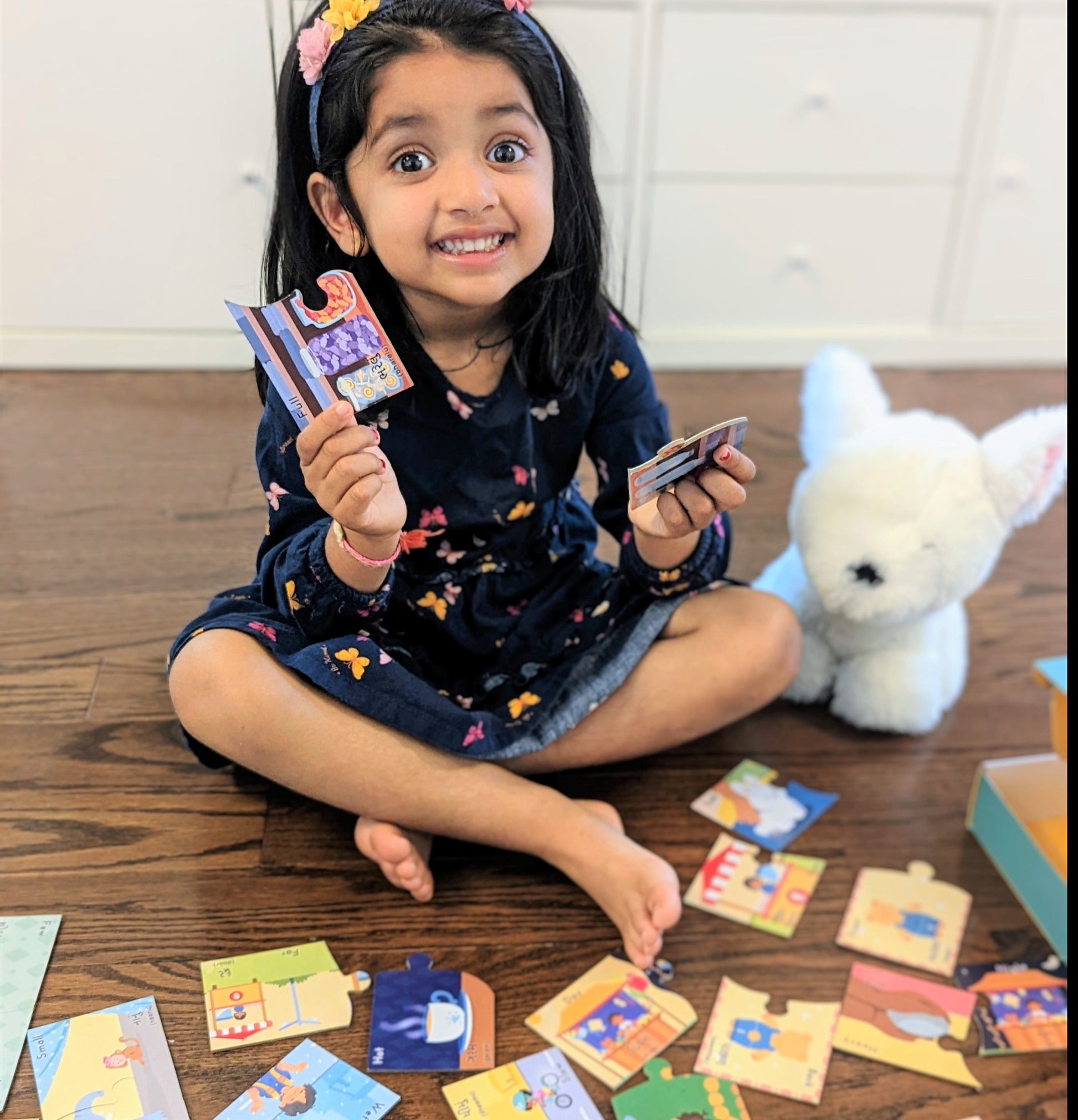happy-preschooler-matching-bilingual-opposites-puzzles