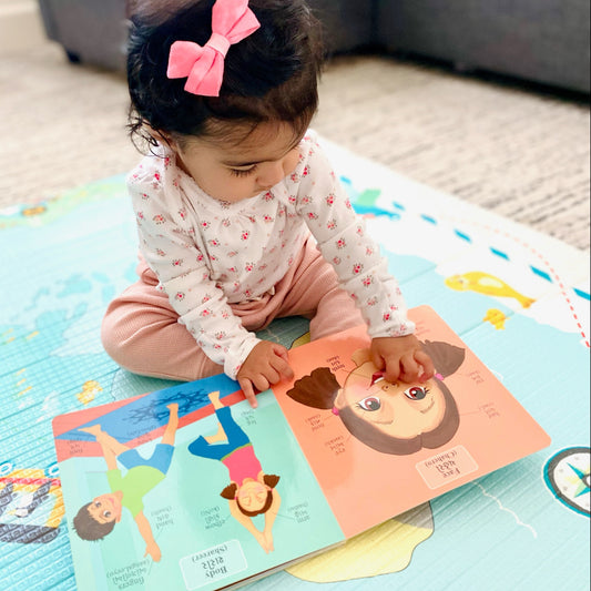 a baby girl learning her first words in gujarati